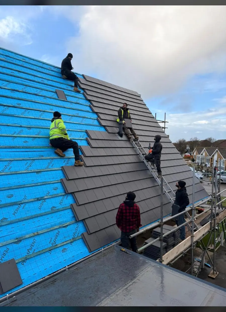 Reliable Roofers team battening a re-roof over blue breathable membrane in Bedfordshire